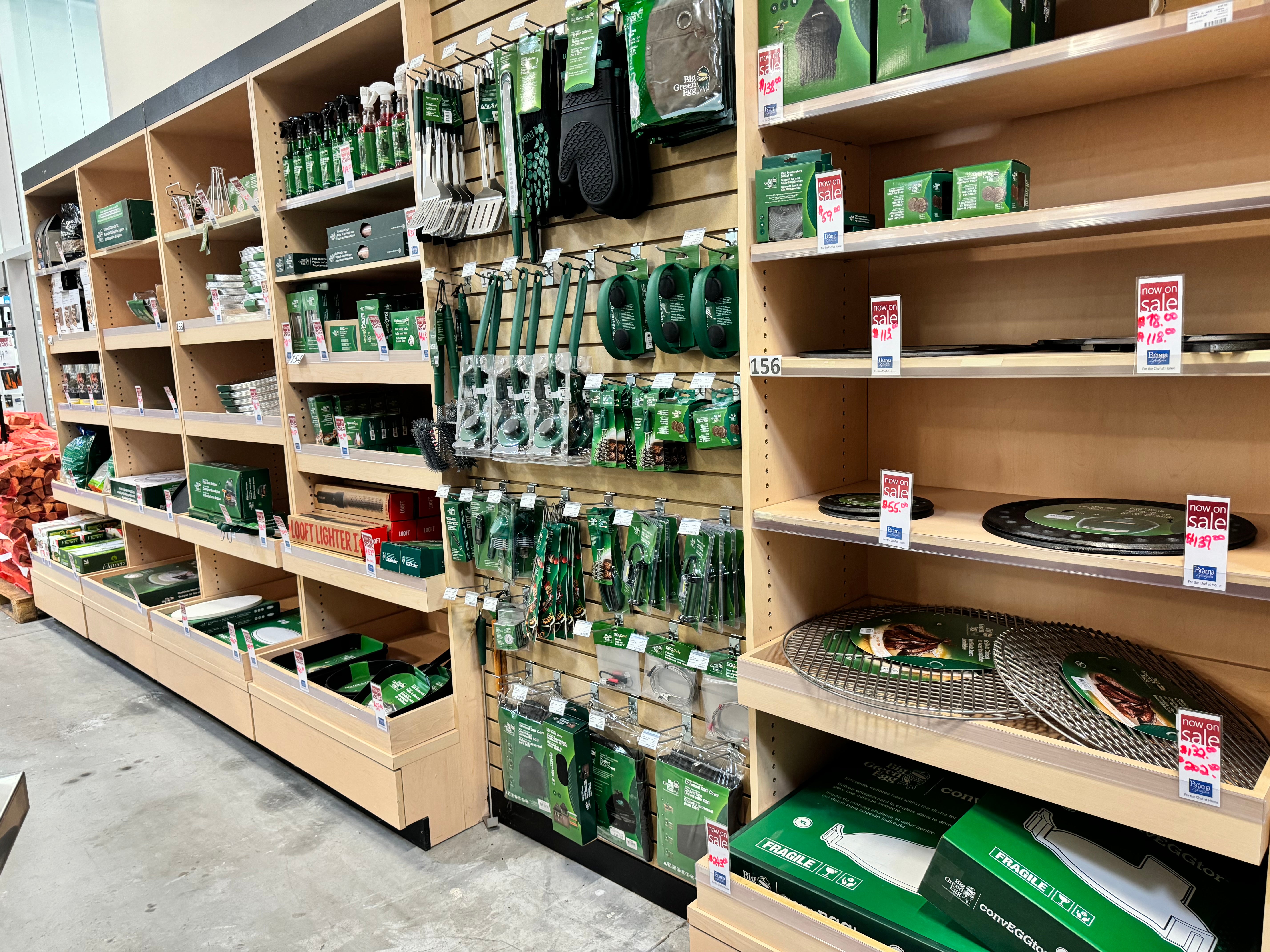 Big green egg accessory wall inside brama lifestyles showroom.