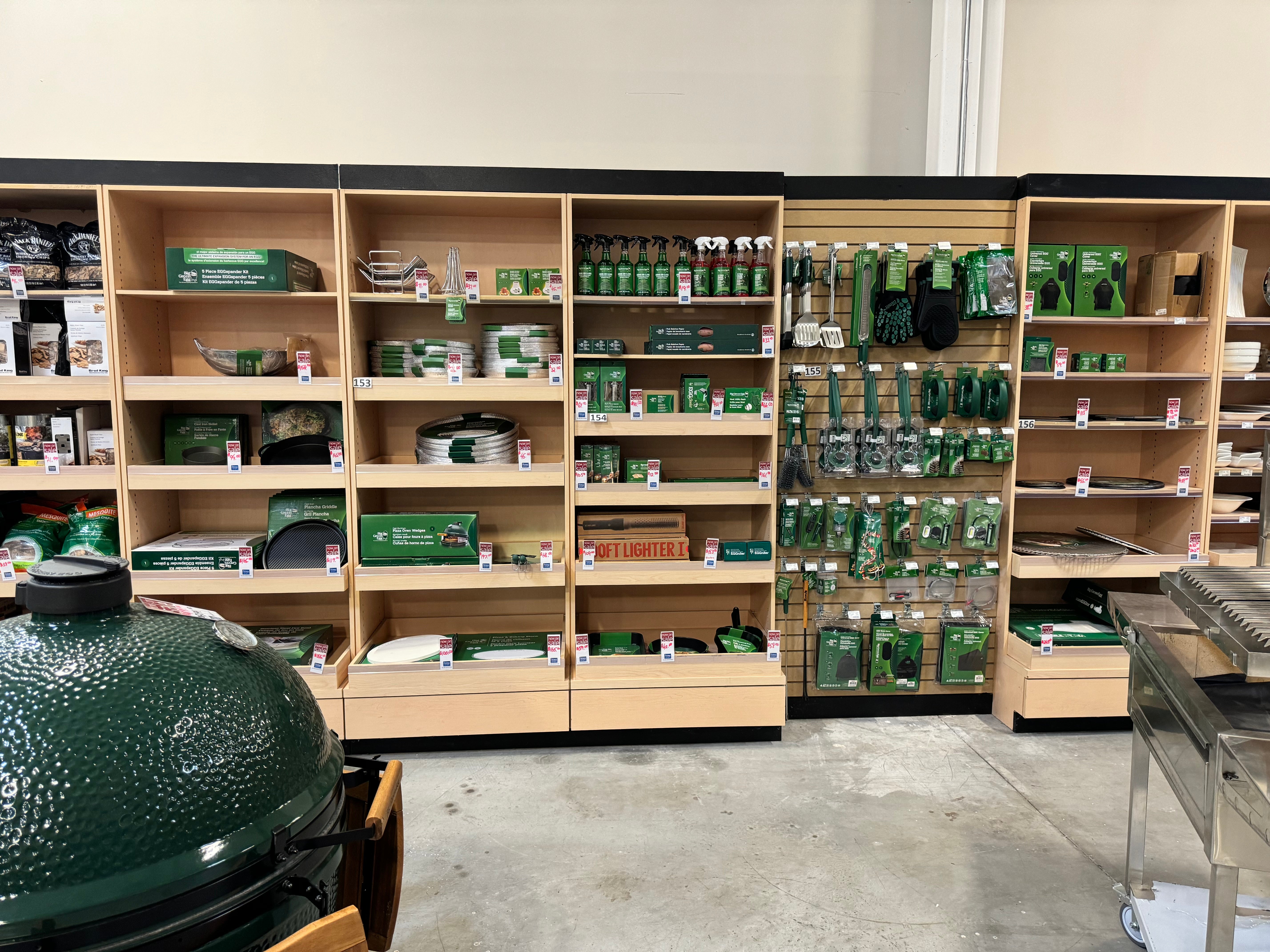 Big green egg accessory wall inside brama lifestyles showroom.