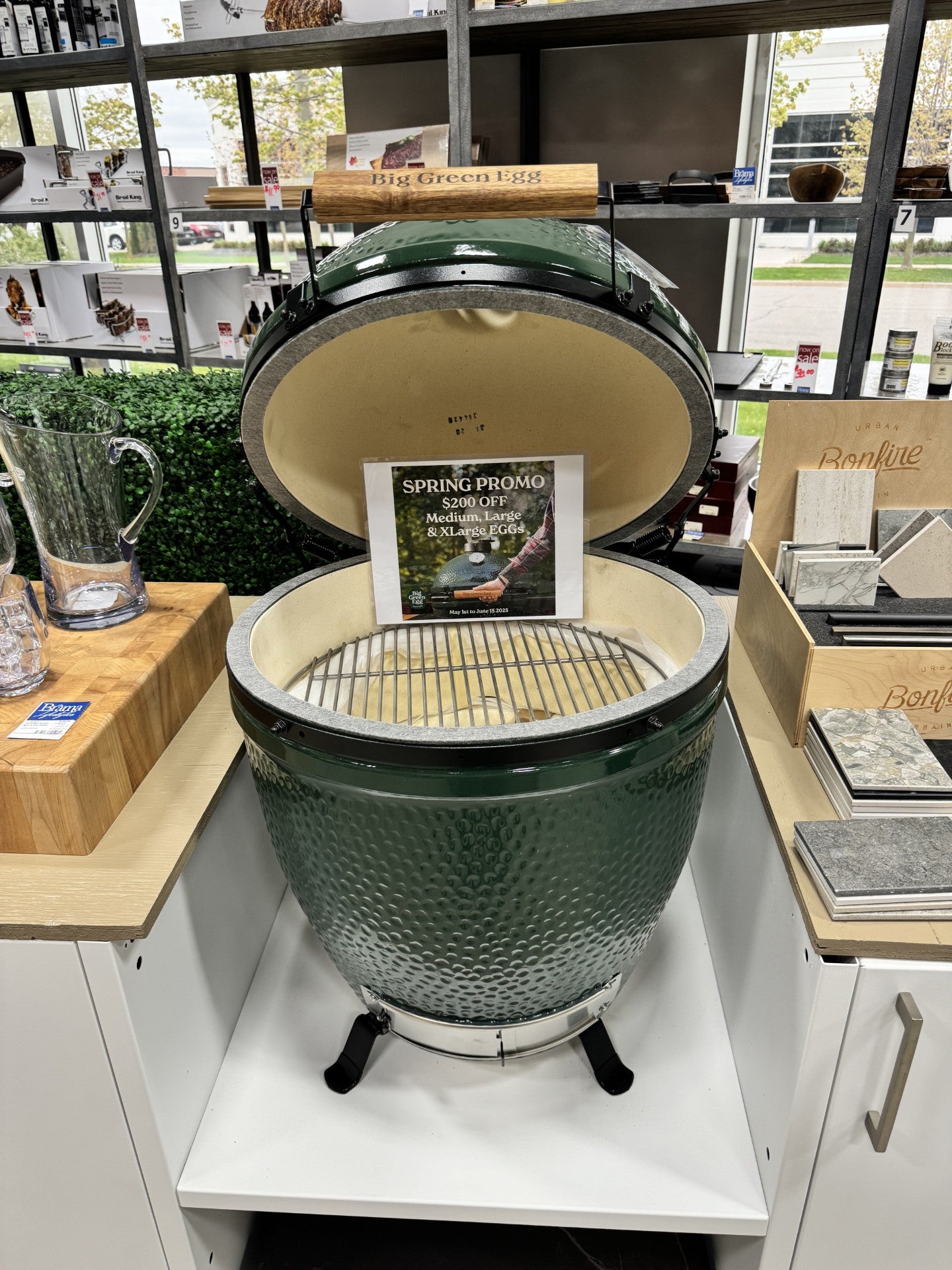 Large sized big green egg from Brama showroom. On Sale sign.