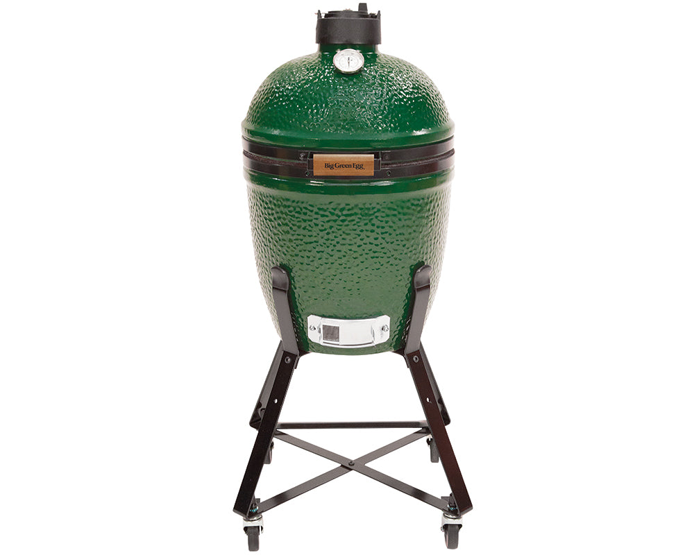 Small sized big green egg in a nest stand with wheels on the bottom. White background.